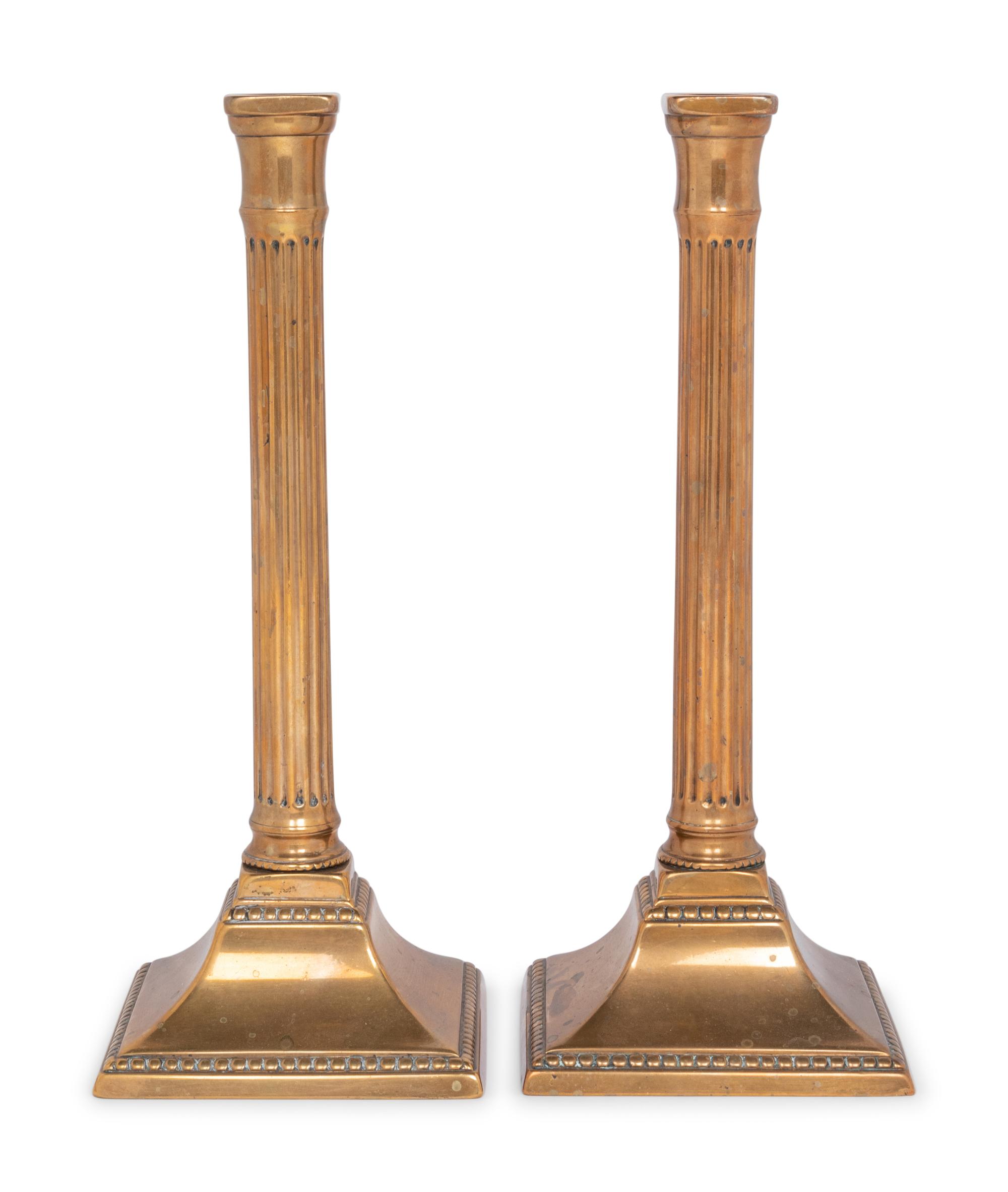 A Pair of George III Bronze Candlesticks