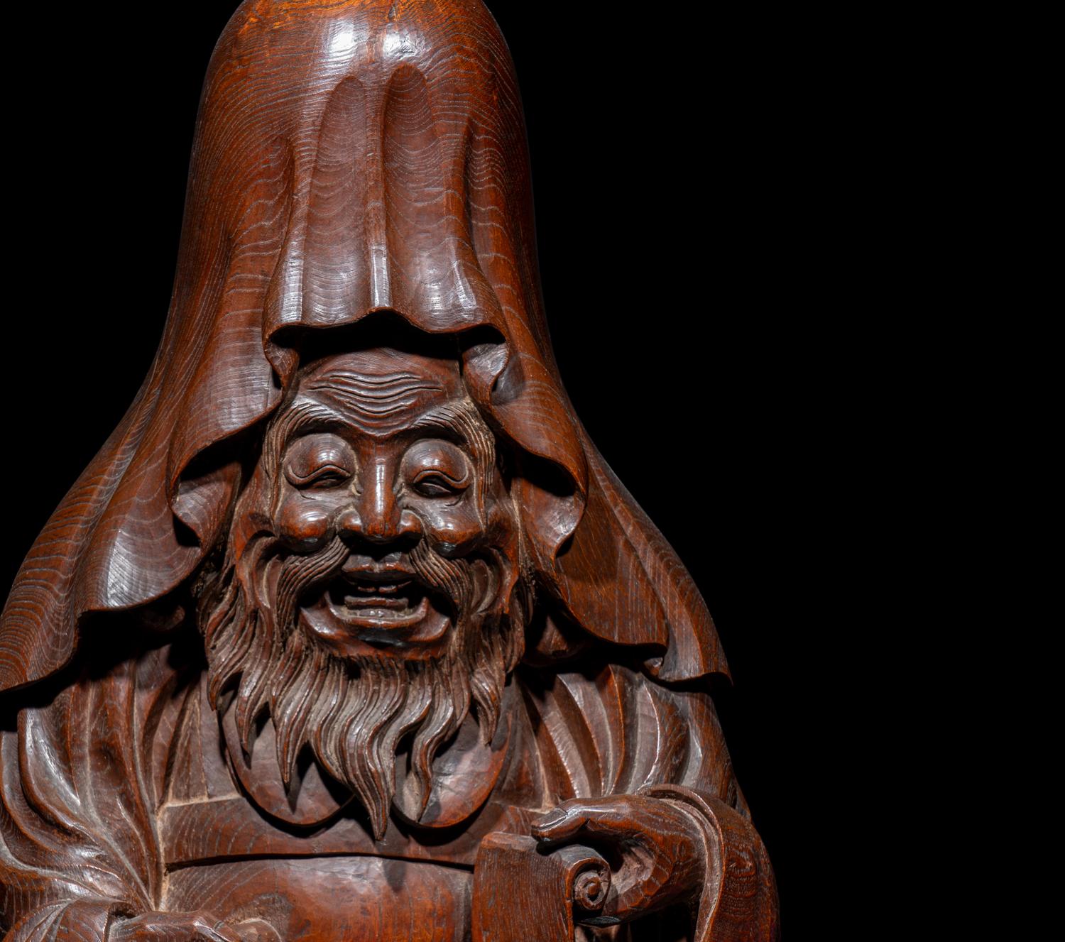 The Nagatani Trademark - A Japanese Carved Hardwood Figure of a Wise Man