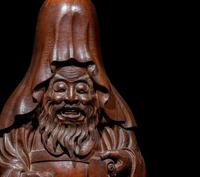 The Nagatani Trademark - A Japanese Carved Hardwood Figure of a Wise Man