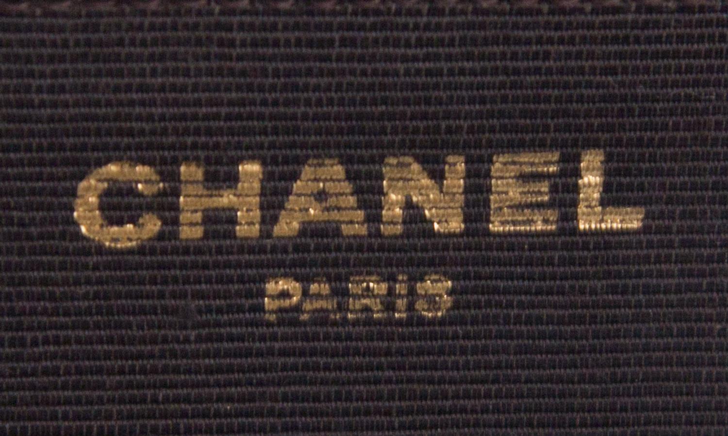 A Chanel Brown Velvet Handbag, 8.5" x 6" x 1".