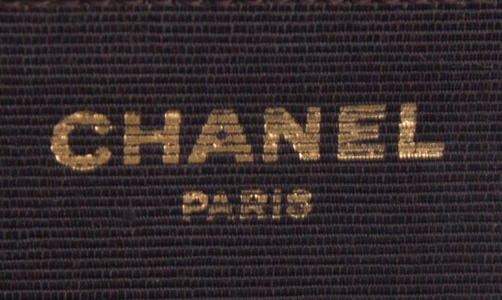 A Chanel Brown Velvet Handbag, 8.5" x 6" x 1".