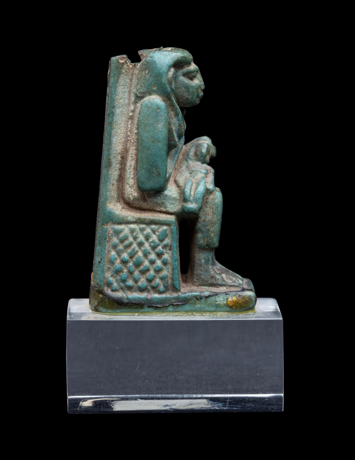 An Egyptian Faience Isis Nursing Horus