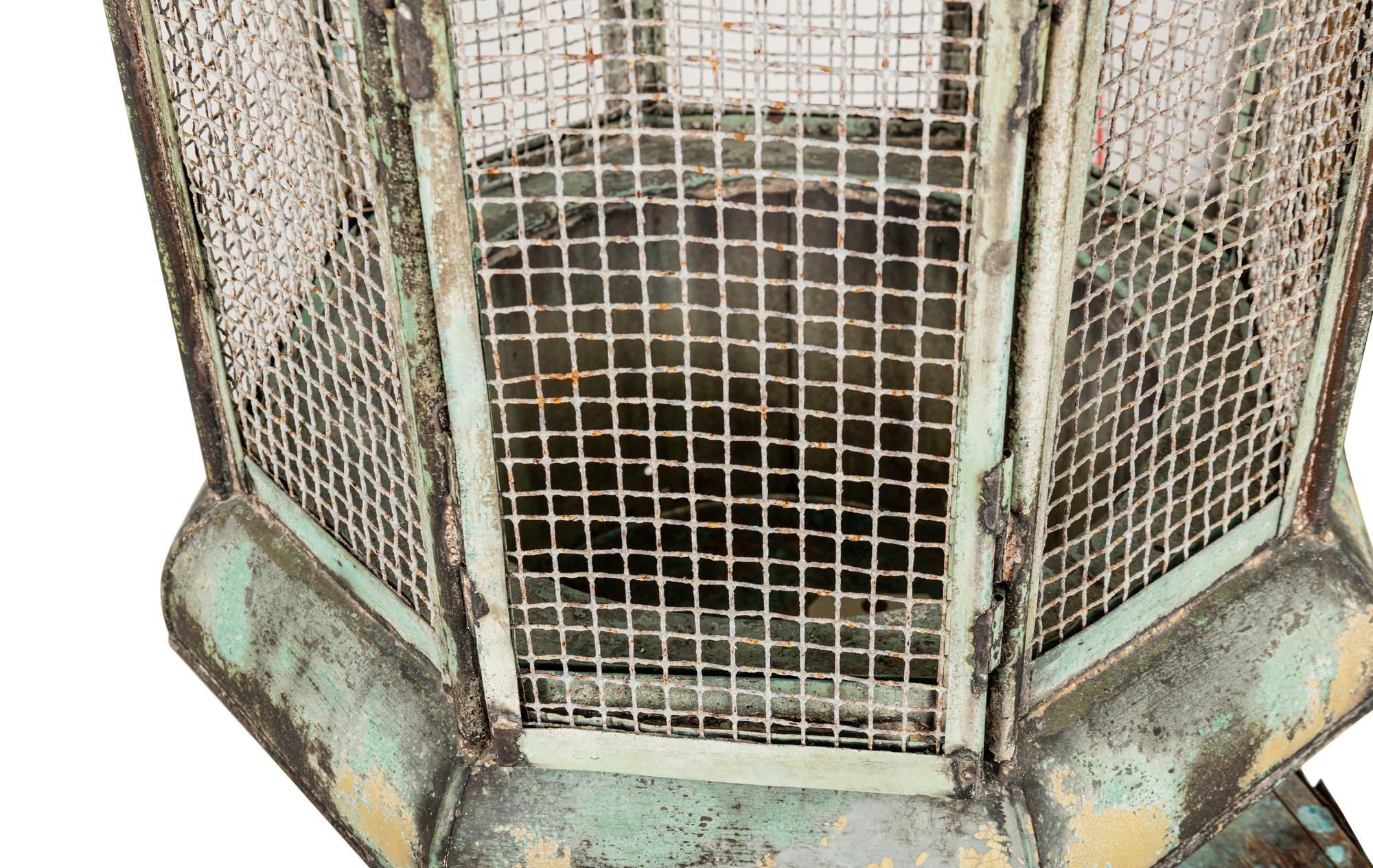A Pair of Weathered Painted Sheet Metal Lanterns Converted to Bird Cages