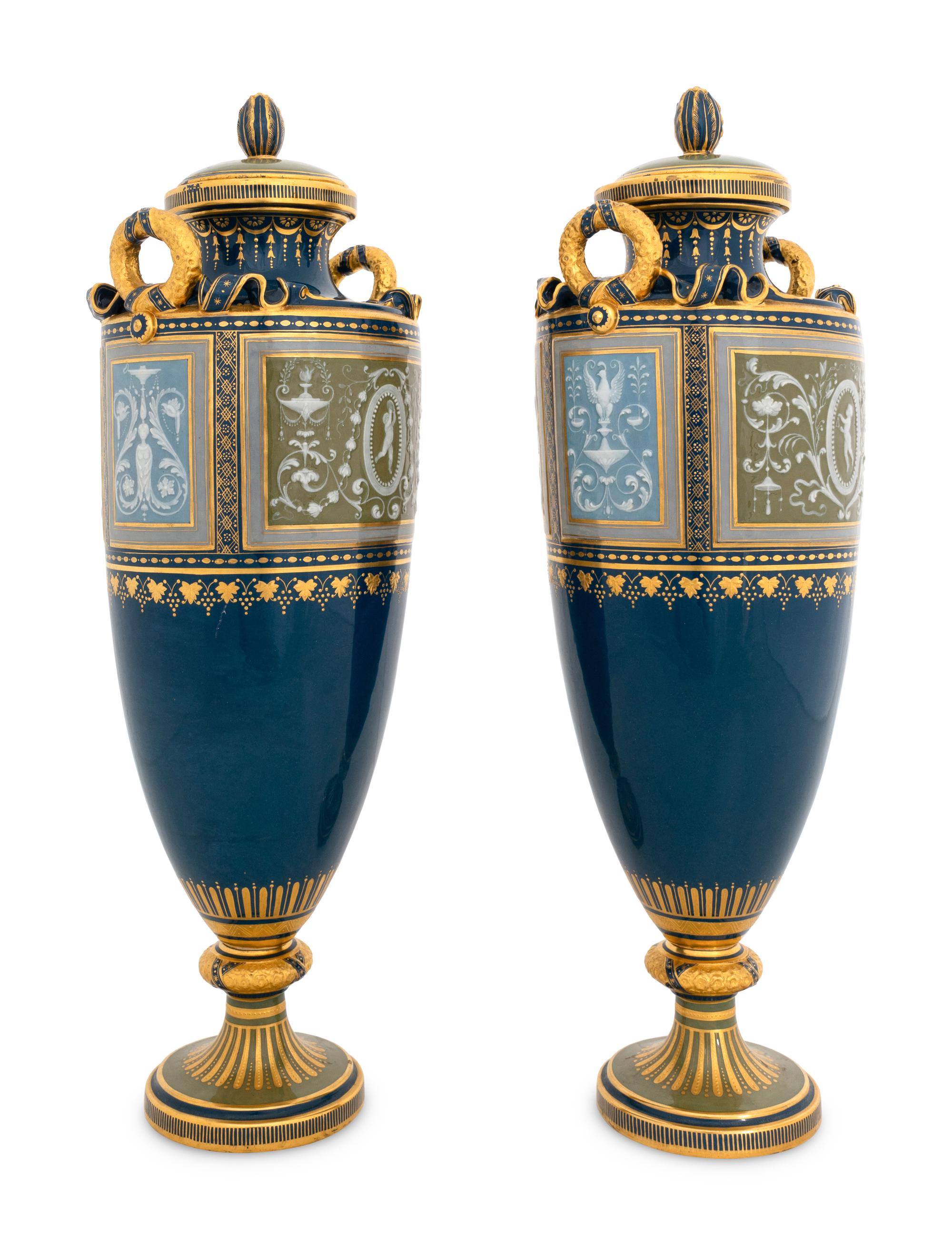 A Pair of Mintons Pâte-sur-Pâte Peacock Blue Covered Urns