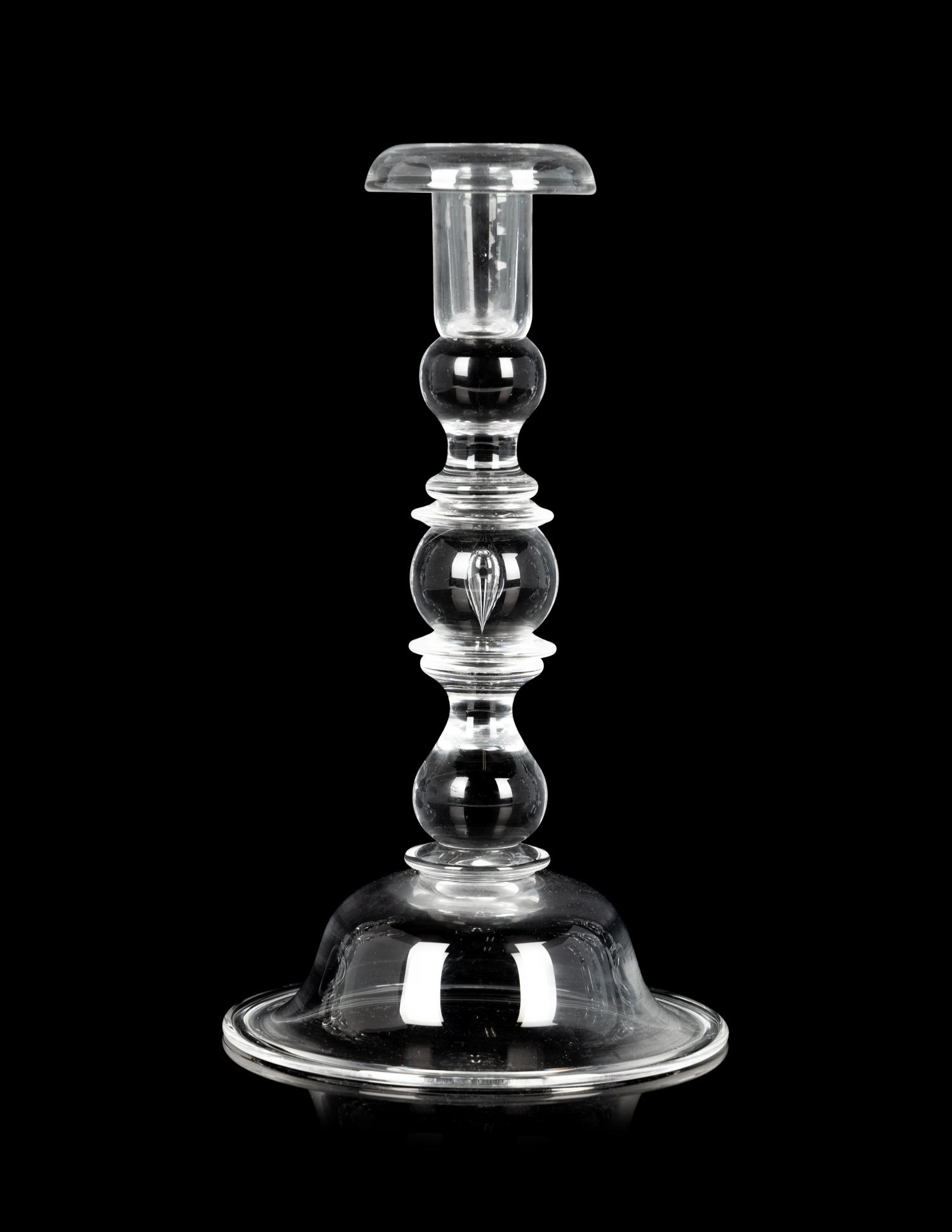 A Set of Four Steuben Glass Candlesticks