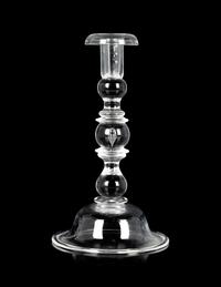 A Set of Four Steuben Glass Candlesticks