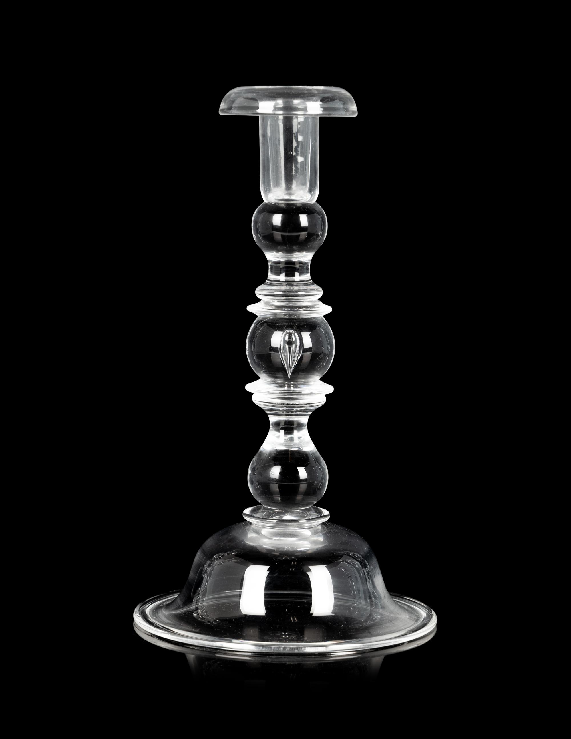 A Set of Four Steuben Glass Candlesticks
