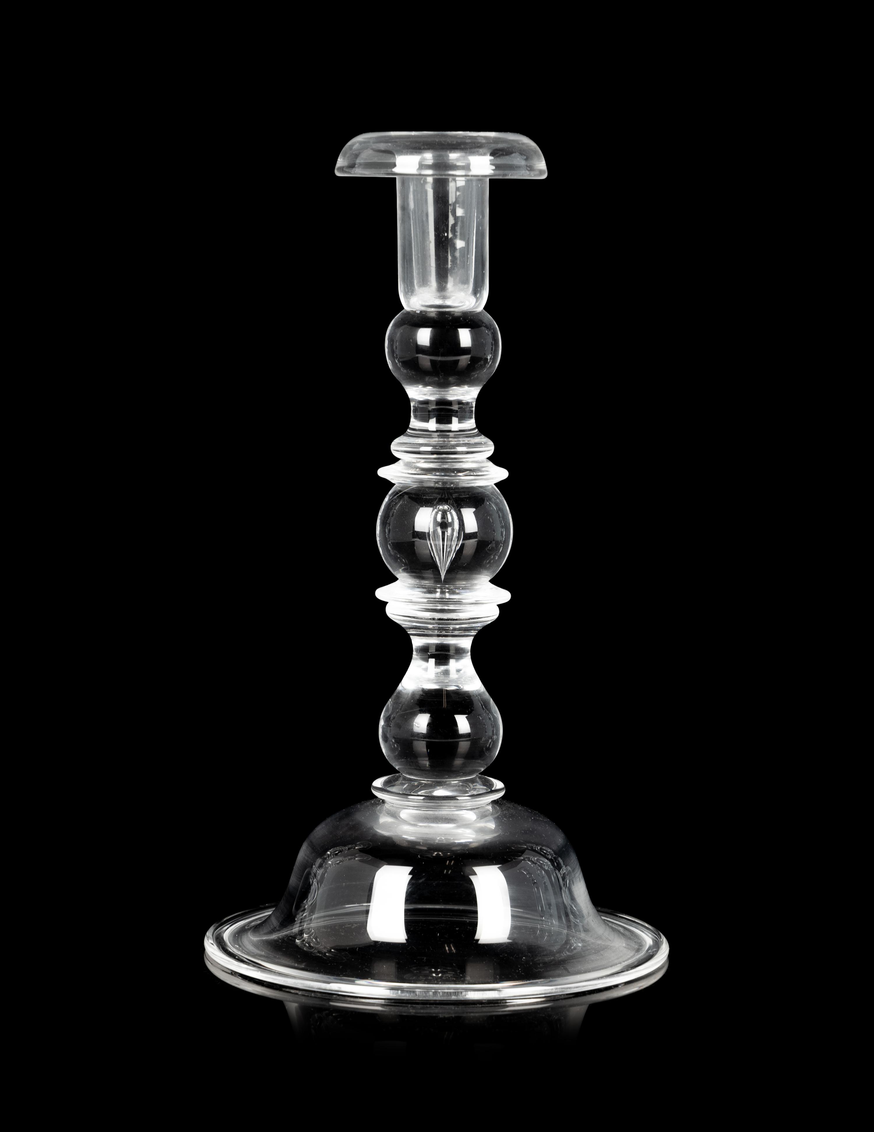 A Set of Four Steuben Glass Candlesticks