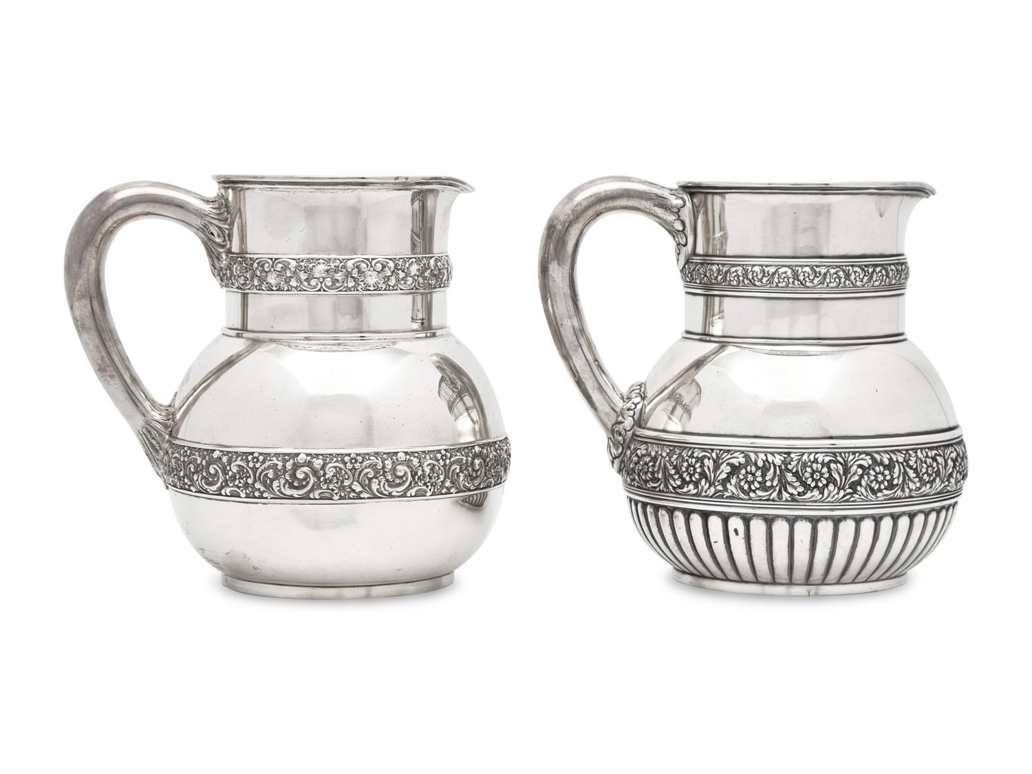 Two Similar Sterling Silver Floral Repousse Water Pitchers, Tiffany & Co., New York, NY, Circa 1880-1890s