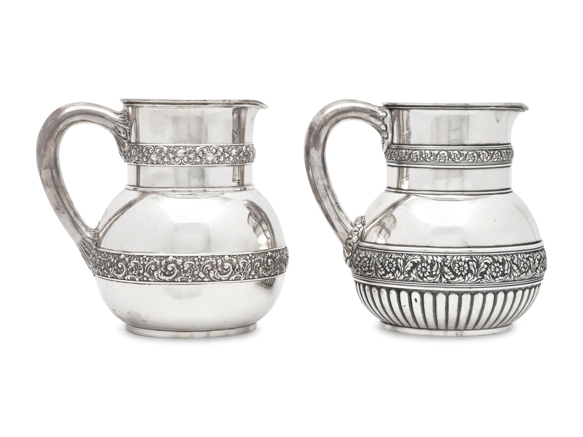 Two Similar Sterling Silver Floral Repousse Water Pitchers, Tiffany & Co., New York, NY, Circa 1880-1890s