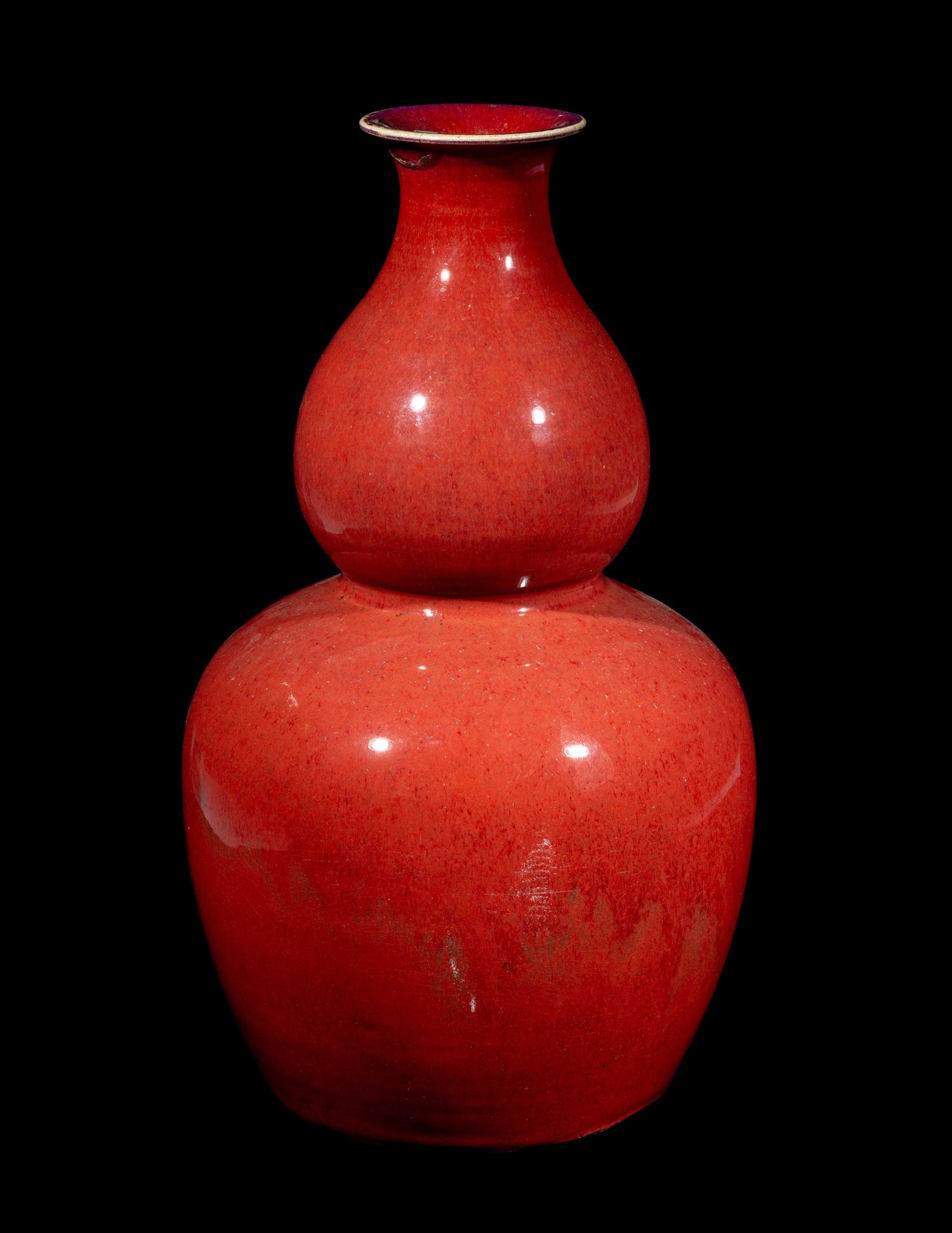 A Chinese Sang-de-Boeuf Glazed Porcelain Gourd-Form Vase
