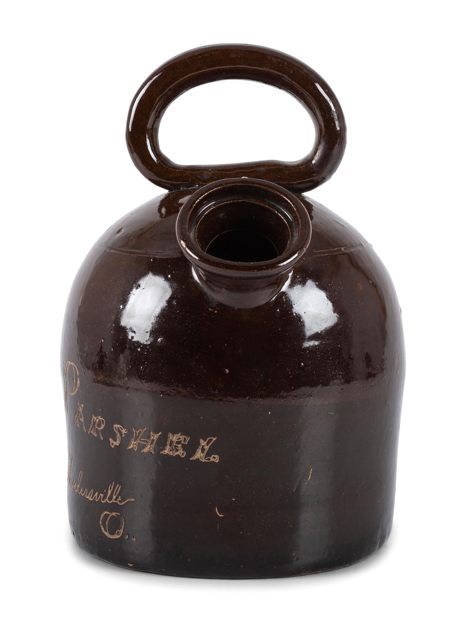 An Ohio Stoneware Albany Slip Harvest Jug