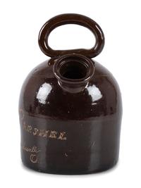 An Ohio Stoneware Albany Slip Harvest Jug