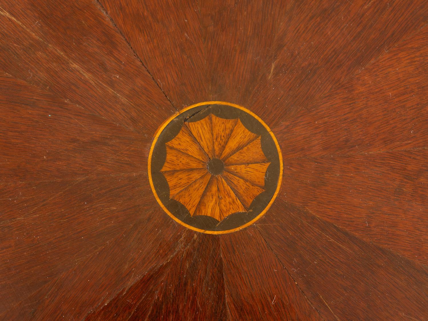 An English Marquetry Inlaid Parcel Ebonized Mahogany Center Table