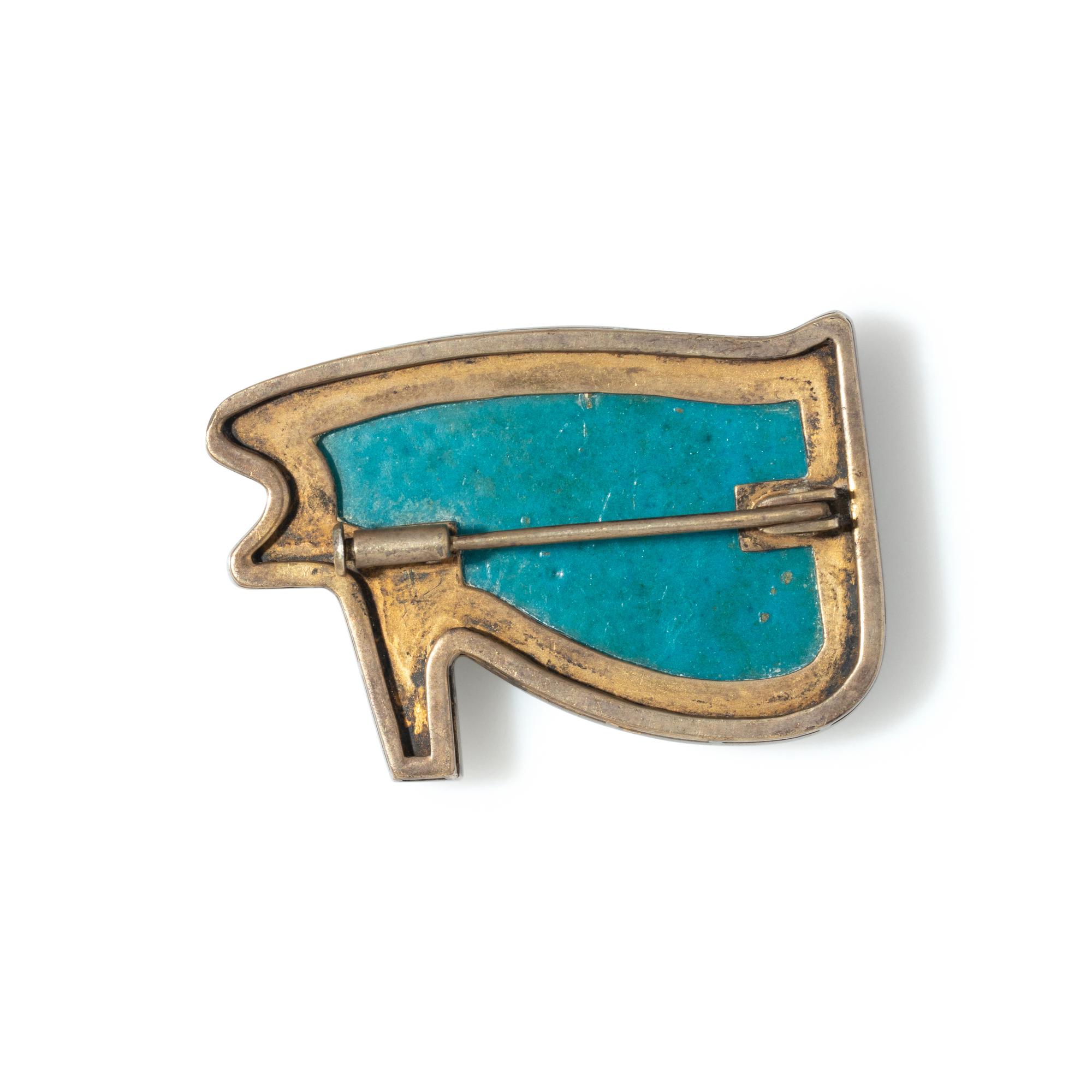 An Egyptian Blue Faience Wadjet Eye — Set in a silver brooch