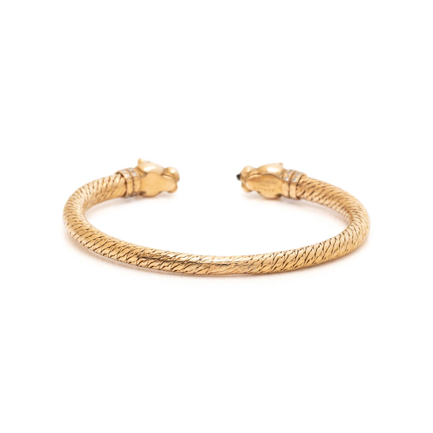 CARTIER, YELLOW GOLD, DIAMOND AND SAPPHIRE PANTHÈRE BANGLE BRACELET