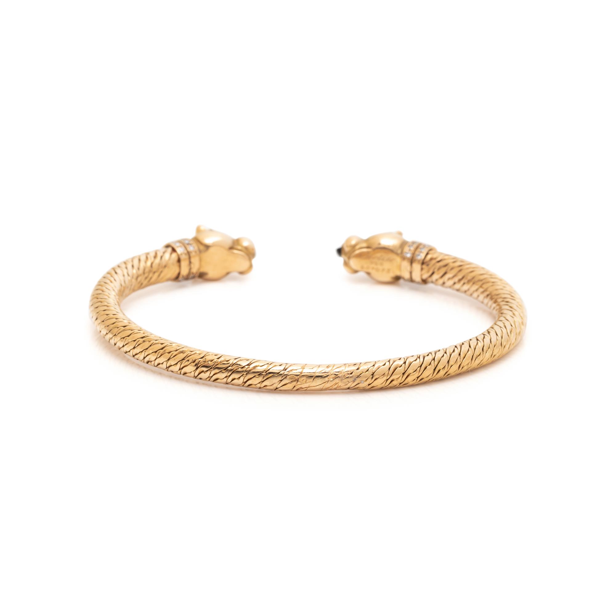 CARTIER, YELLOW GOLD, DIAMOND AND SAPPHIRE PANTHÈRE BANGLE BRACELET