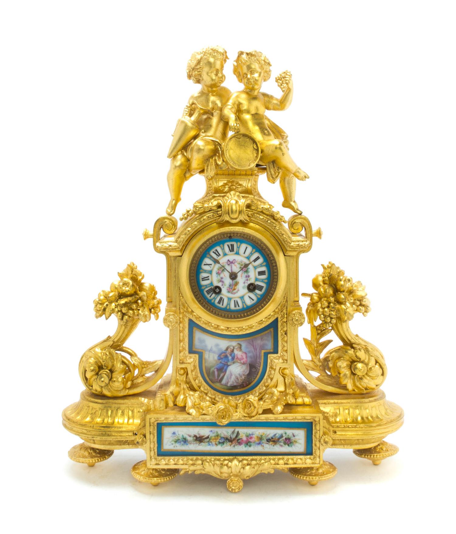 A Louis XVI Style Gilt Metal and Sevres Style Porcelain Mounted Figural Mantel Clock, Height 19 1/8 inches.