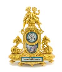 A Louis XVI Style Gilt Metal and Sevres Style Porcelain Mounted Figural Mantel Clock, Height 19 1/8 inches.