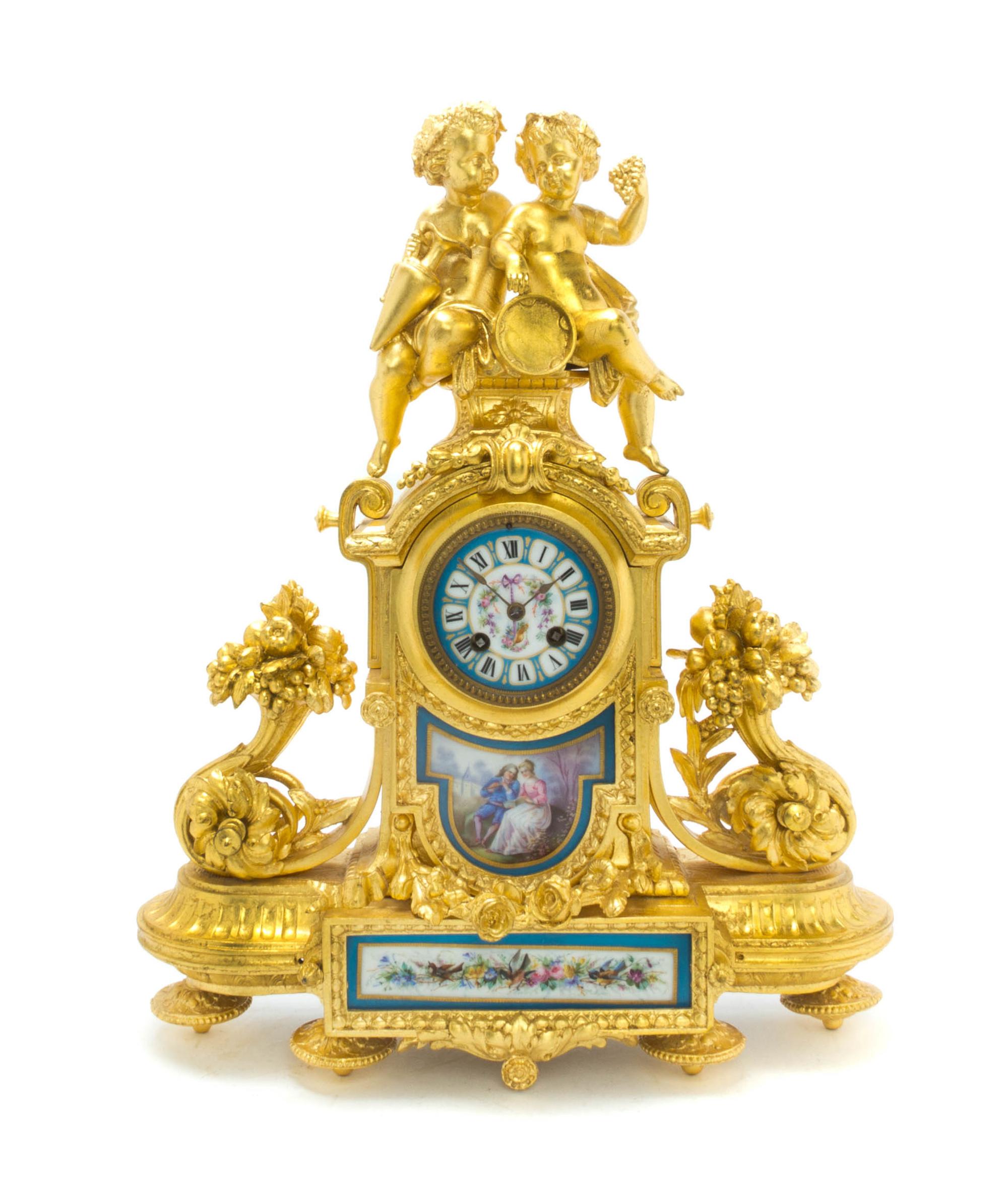 A Louis XVI Style Gilt Metal and Sevres Style Porcelain Mounted Figural Mantel Clock, Height 19 1/8 inches.