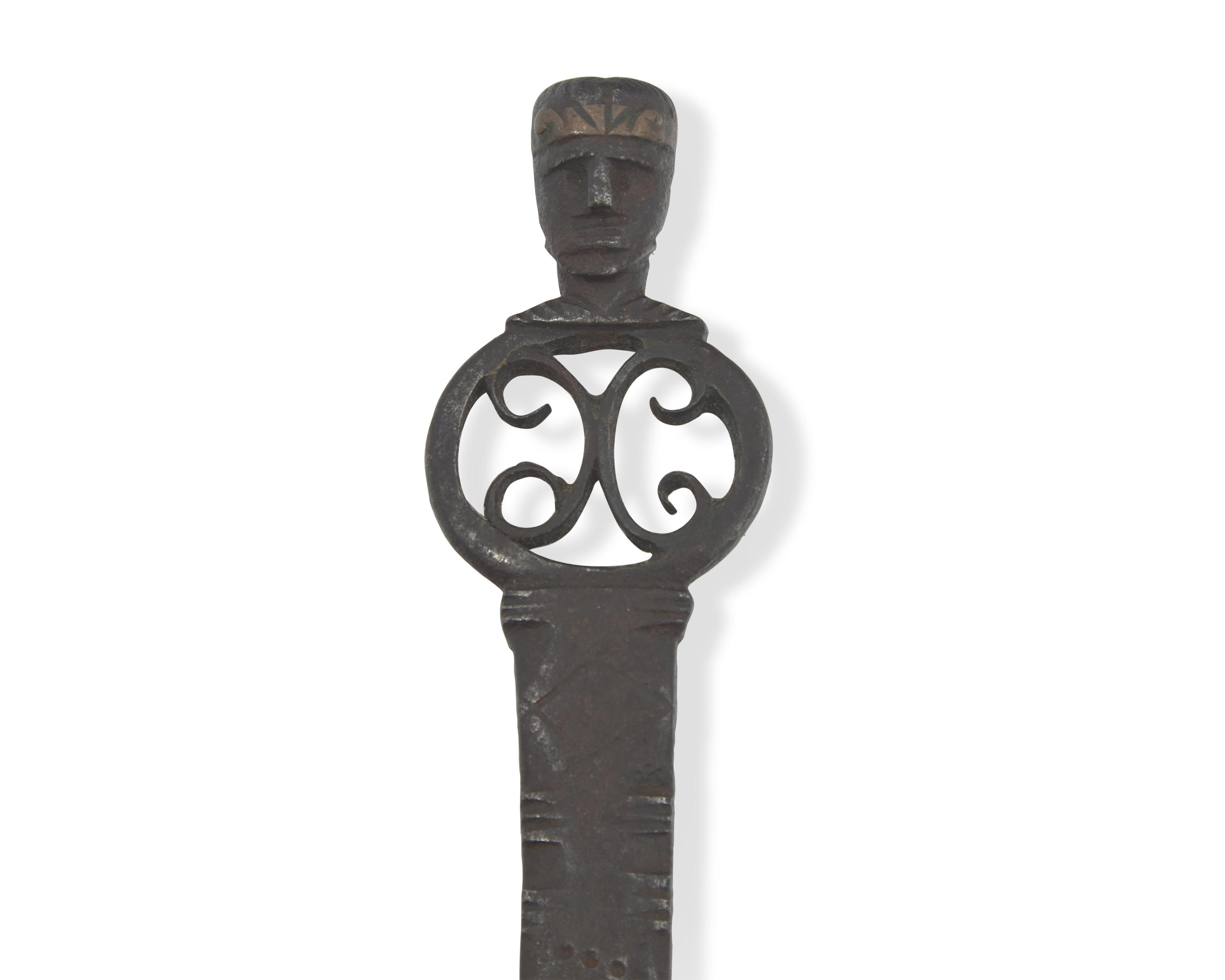 A Copper-Inlaid Wrought Iron Slotted Spoon with Human Head-Form Terminals, Possibly Spanish, 17th Century