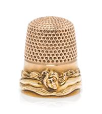 An American 14-Karat Gold Femme Fleur Thimble, Goldsmith, Stern & Co., New York, NY, the knurled top and body above a band worked to sh