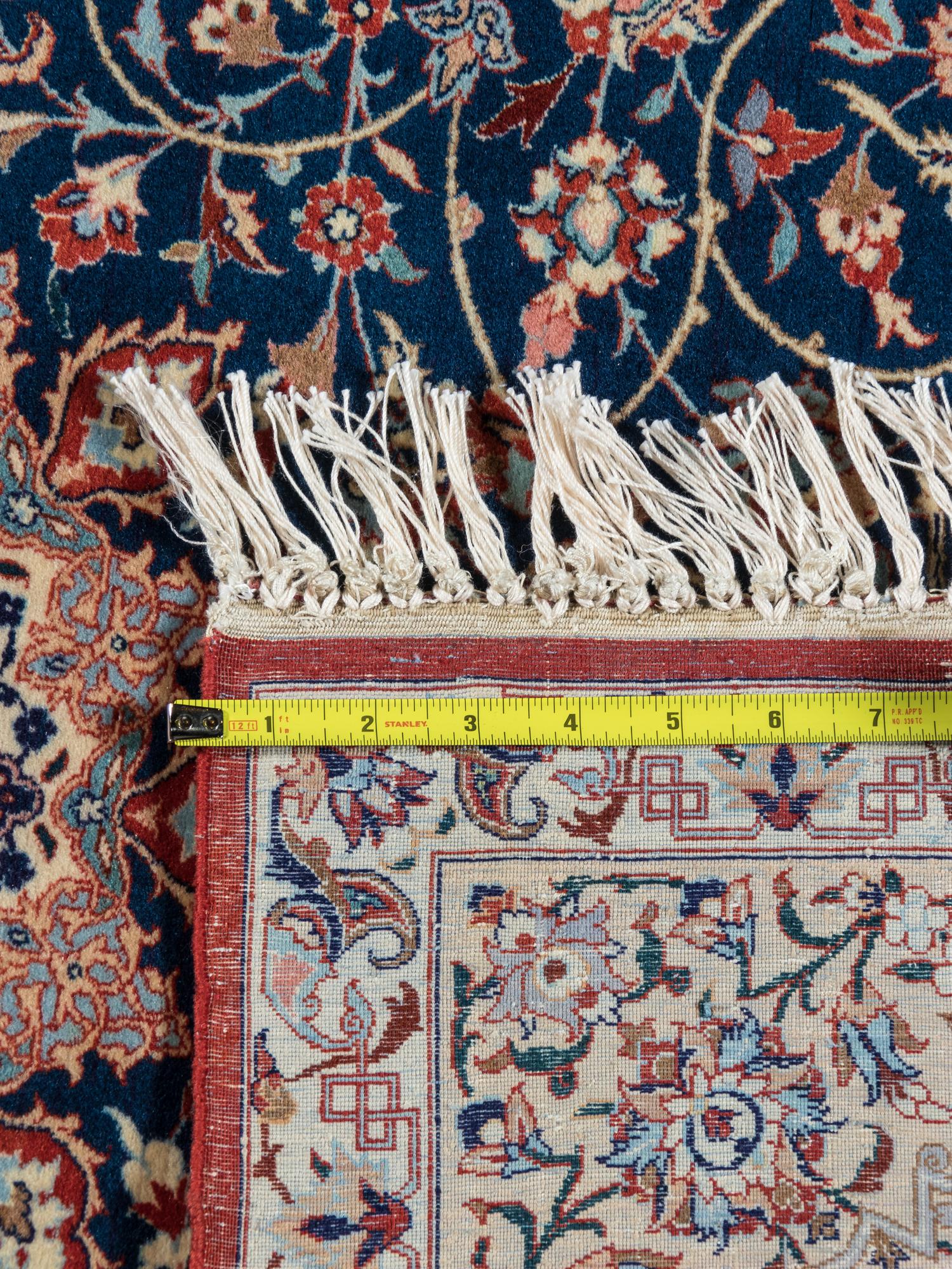 A Signed Isfahan Silk Rug