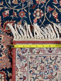A Signed Isfahan Silk Rug