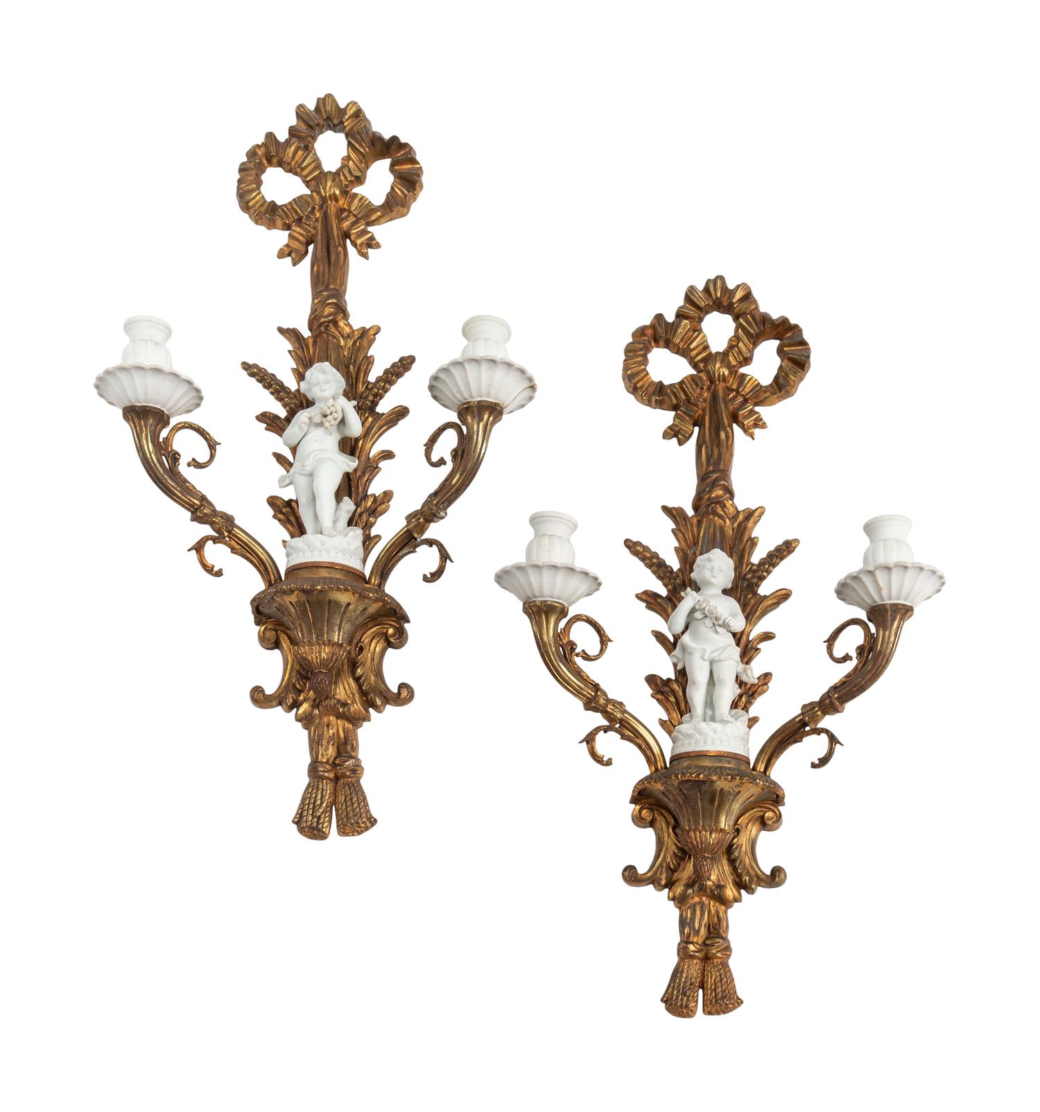 A Pair of Continental Gilt Bronze and Bisque Porcelain Two-Light Sconces