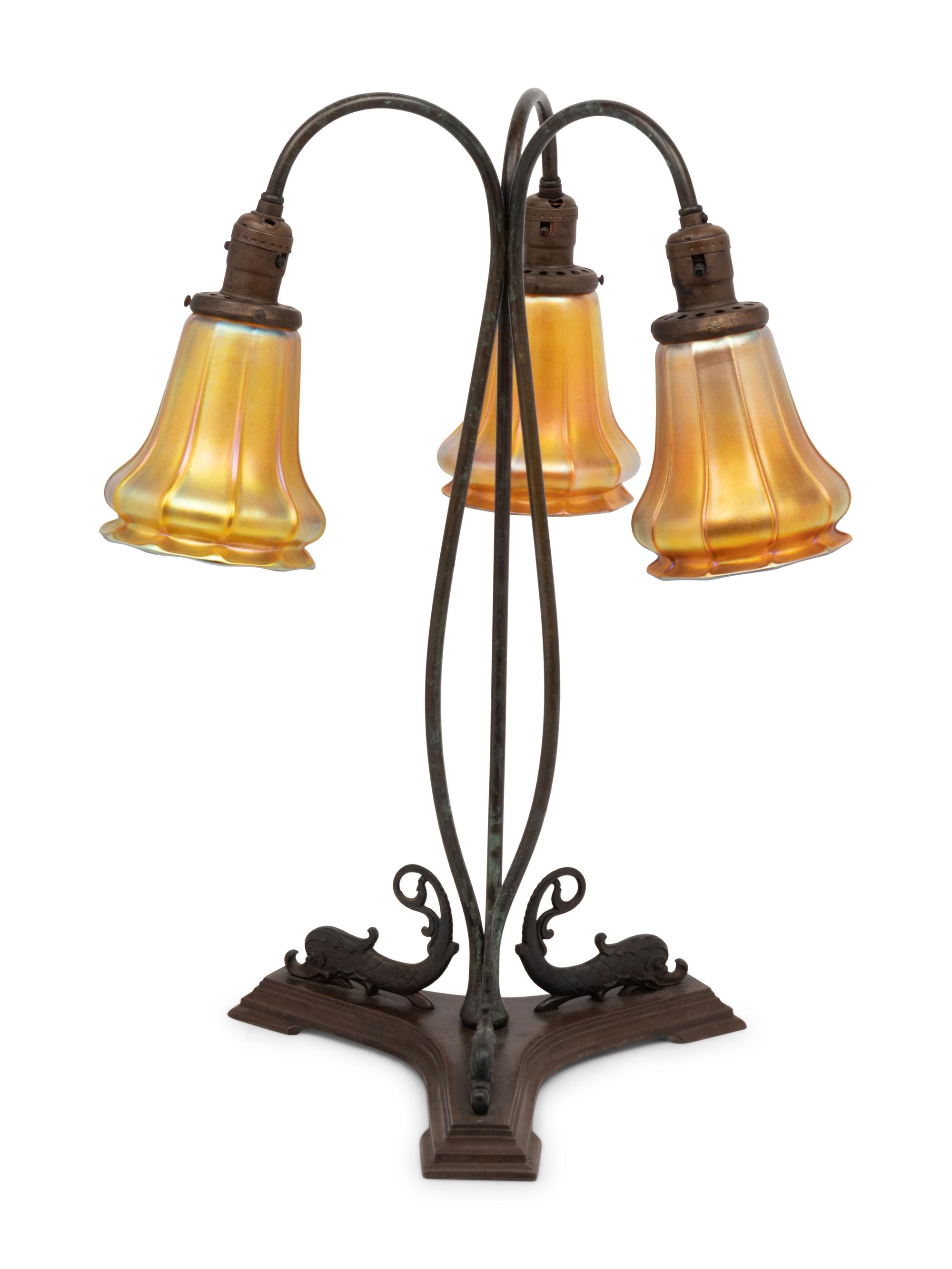 A Cast Metal Three-Light Lamp with Quezal Aurene Glass Shades