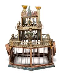 A Folk Art Cut and Painted Metal Paddleboat Form Birdcage