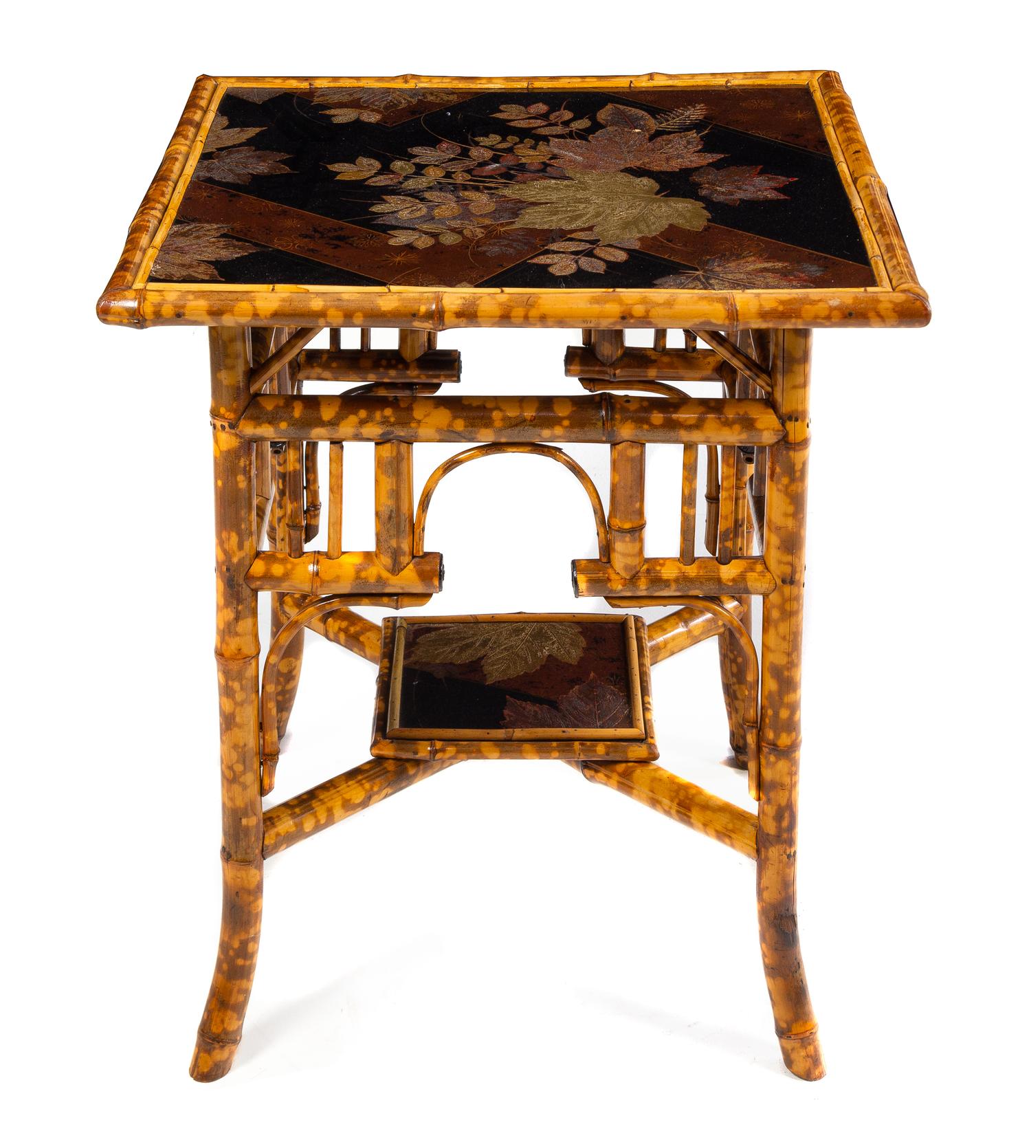 A Victorian Bamboo and Lacquer Table Height 28 1/2 x width 26 x depth 26 inches. — LATE 19TH CENTURY
