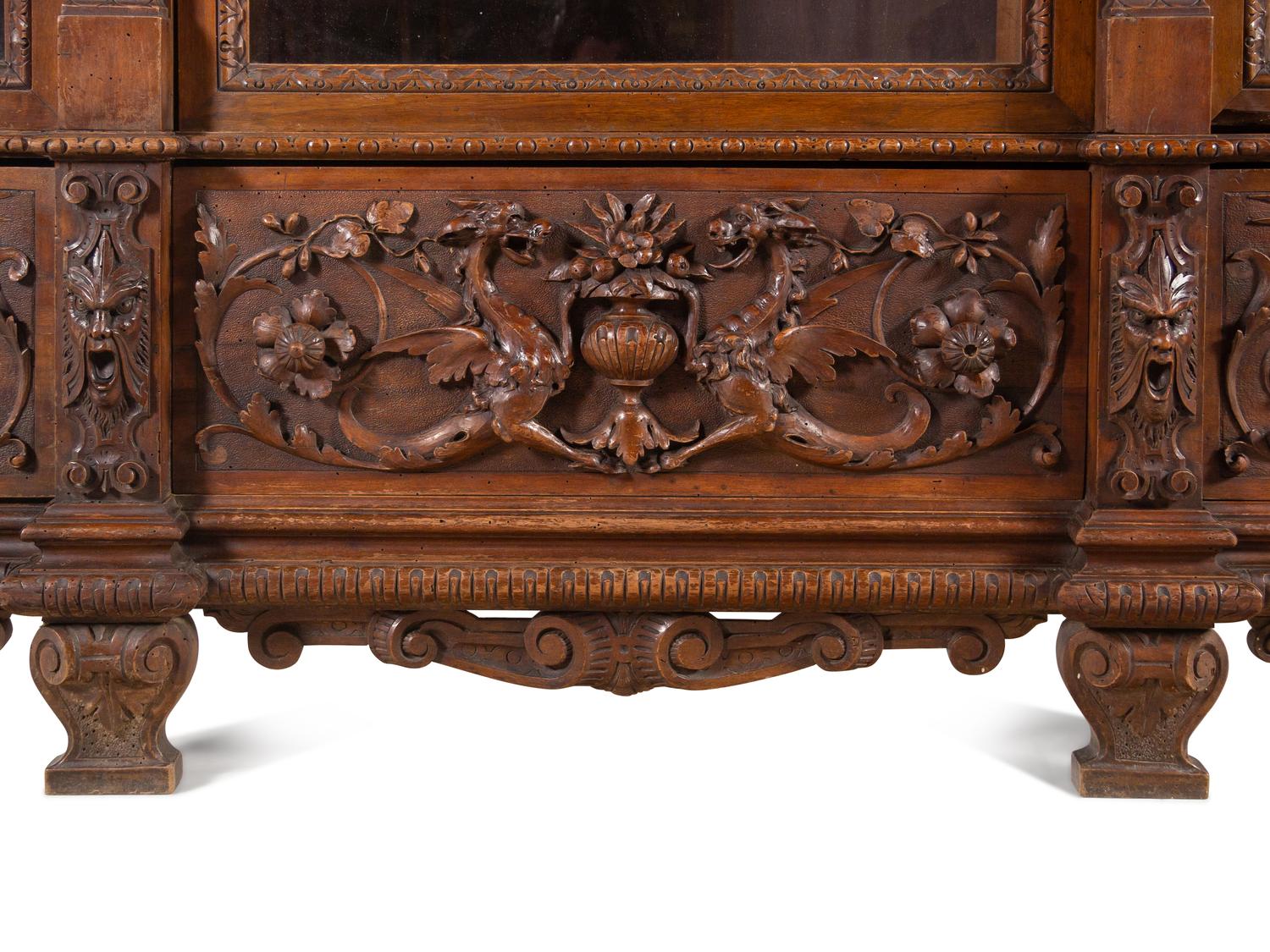 An Italian Renaissance Style Carved Walnut Cabinet