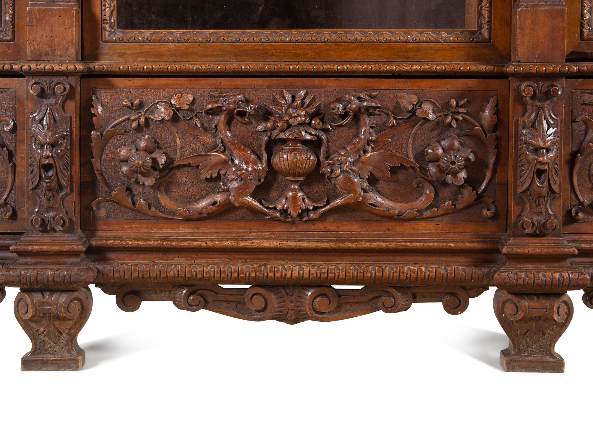 An Italian Renaissance Style Carved Walnut Cabinet