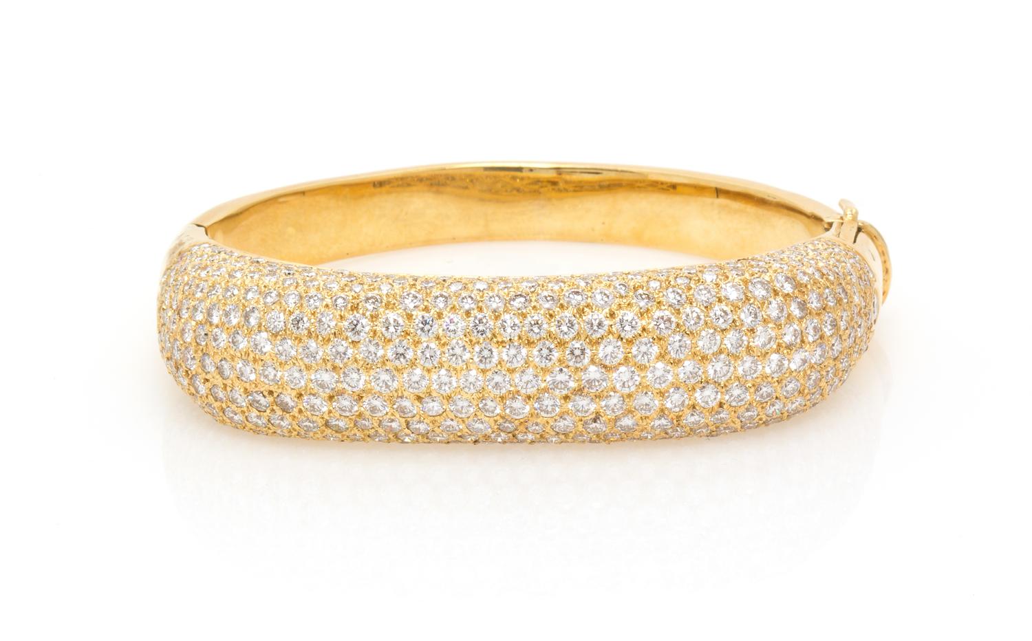 A Yellow Gold and Diamond Bangle Bracelet, 36.30 dwts.