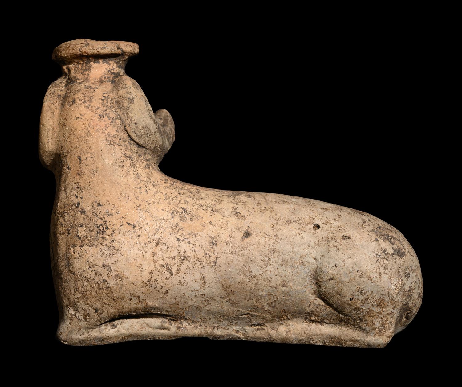 A Corinthian Aryballos in the Form of a Recumbent Ram