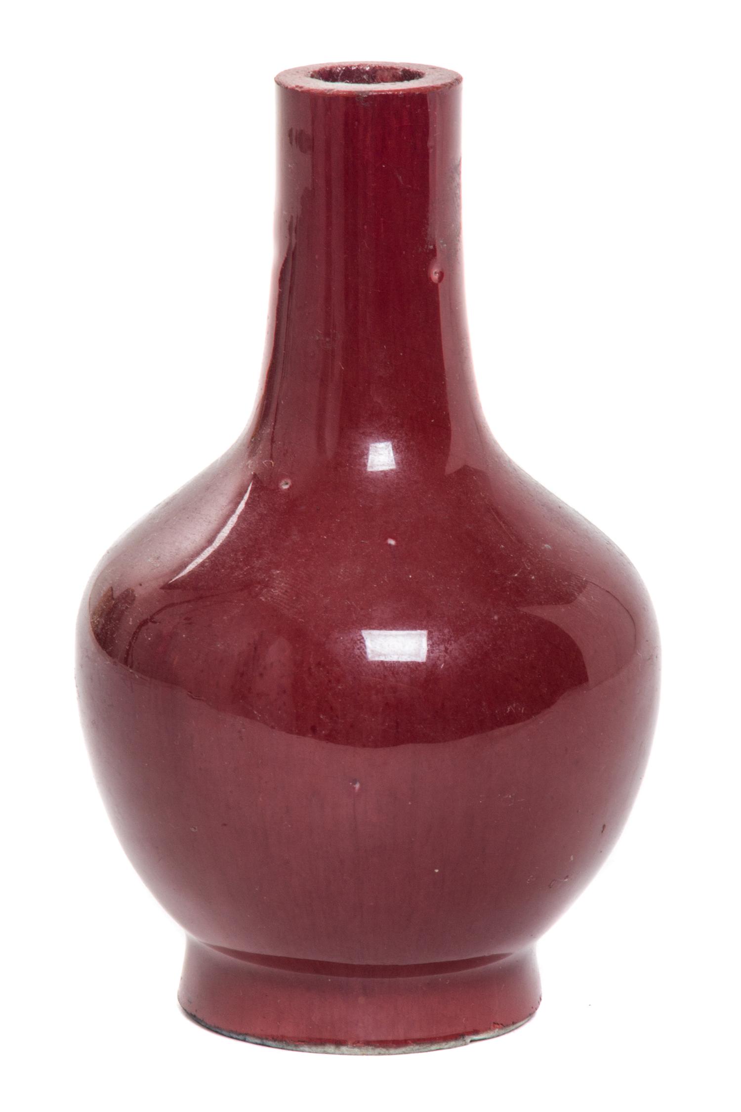 A Small Sang-de-Boeuf Glazed Porcelain Bottle Vase Height 4 3/4 inches.