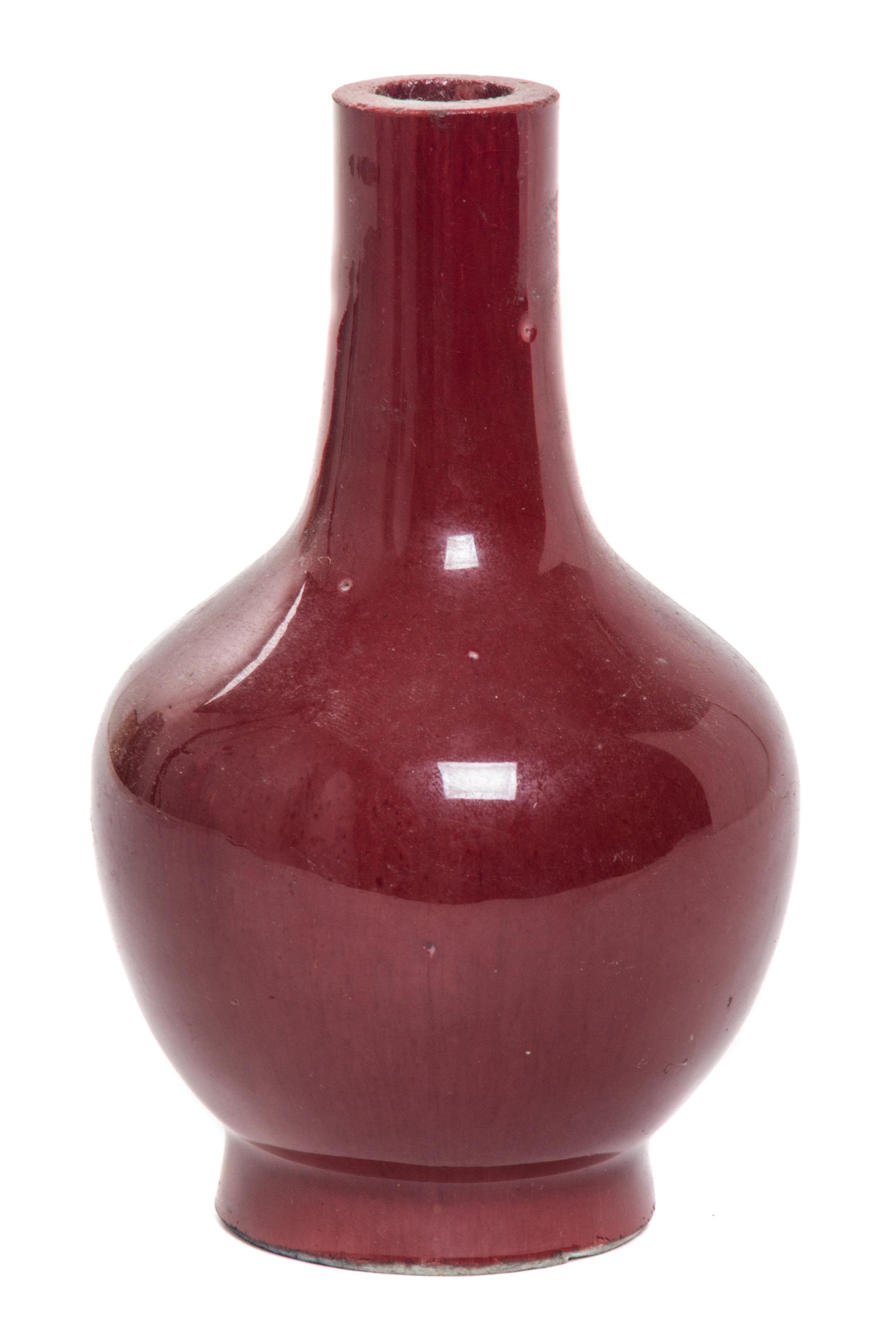 A Small Sang-de-Boeuf Glazed Porcelain Bottle Vase Height 4 3/4 inches.