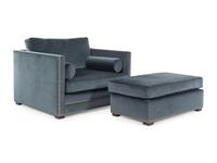 A Contemporary Velvet-Upholstered Armchair and Ottoman