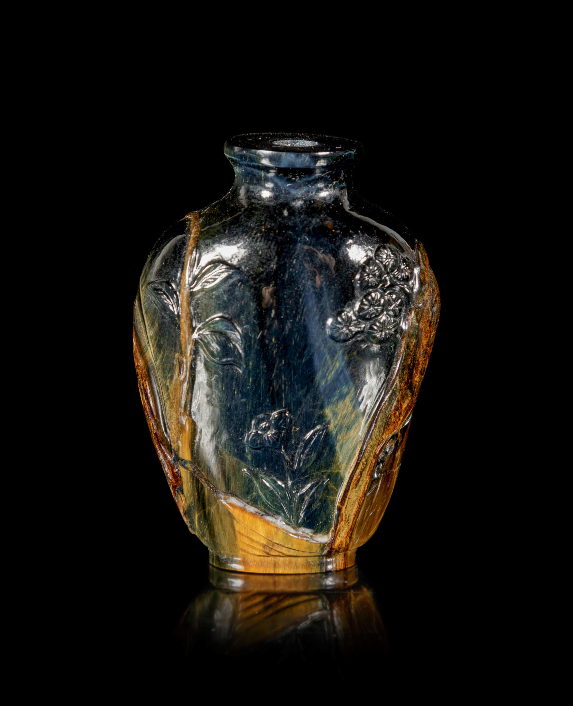 A Carved Tiger’s Eye Snuff Bottle
