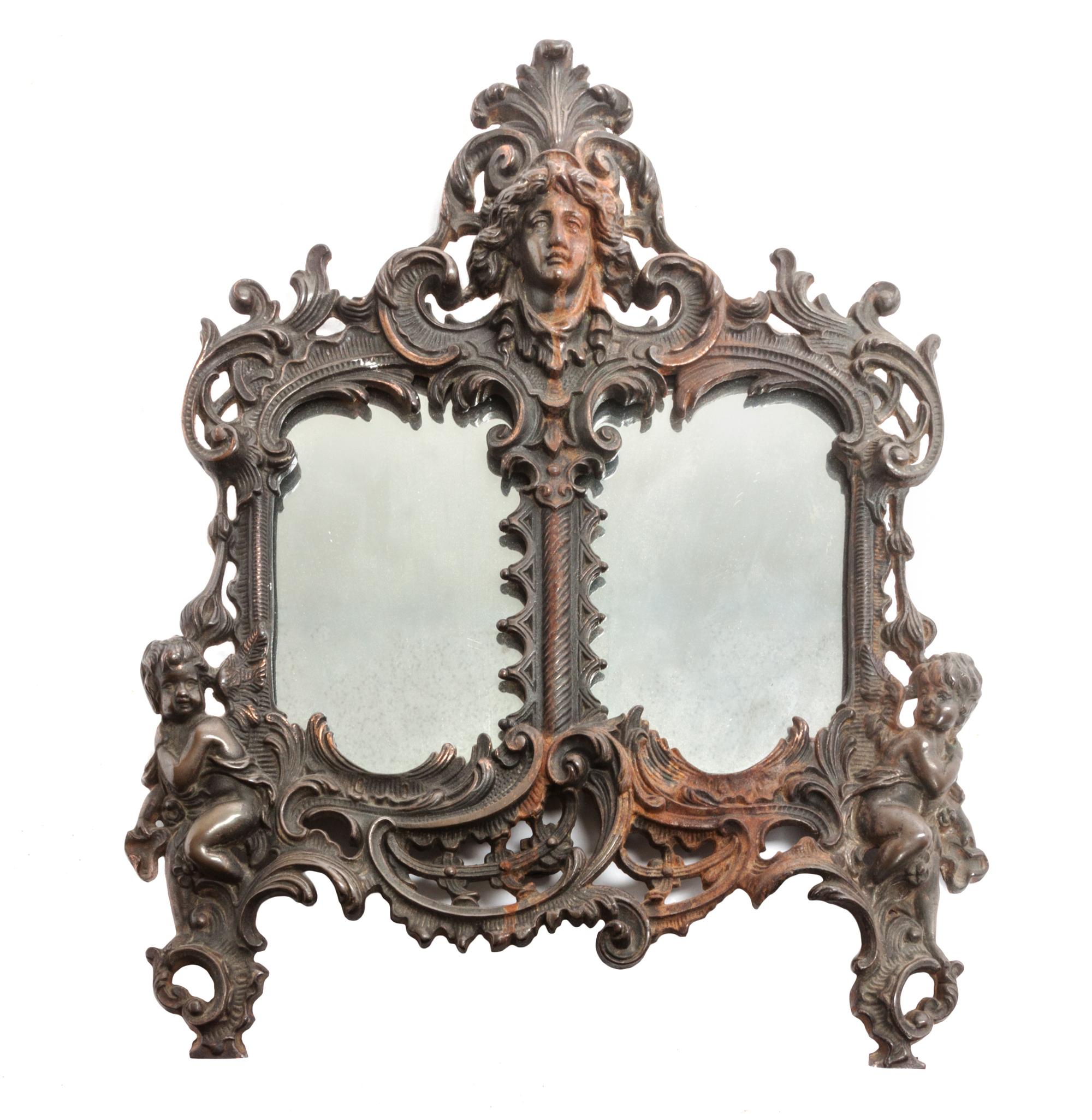 A Continental Bronze Table Mirror 13 1/2 x 12 inches.