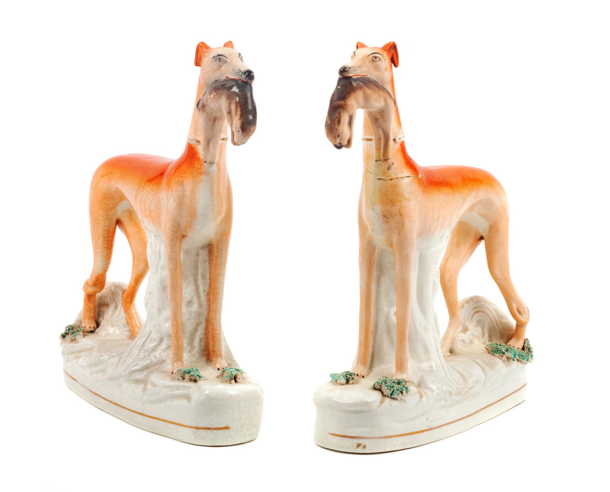 A Pair of Staffordshire Models of Greyhounds Height 11 1/4 inches.