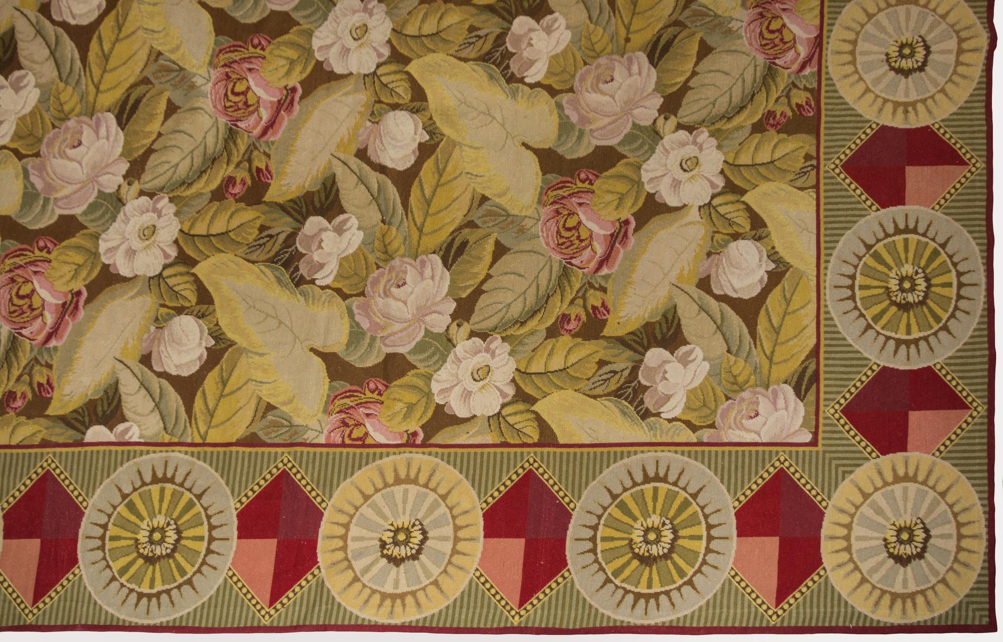 A Continental Needlepoint Rug 16 feet 4 inches x 10 feet 5 inches. — 20TH CENTURY