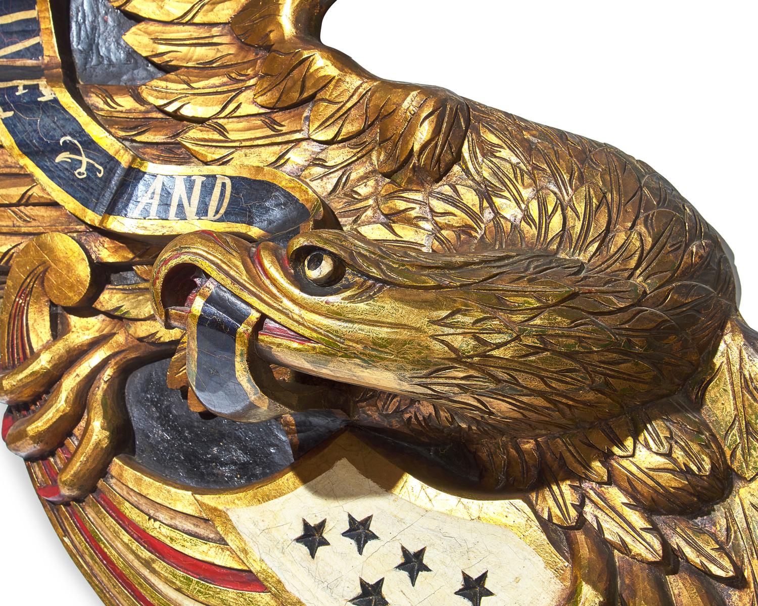 A Carved and Painted Giltwood Eagle