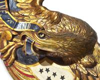A Carved and Painted Giltwood Eagle