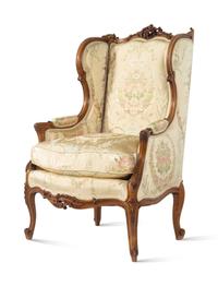 A Louis XV Style Carved Walnut Bergere