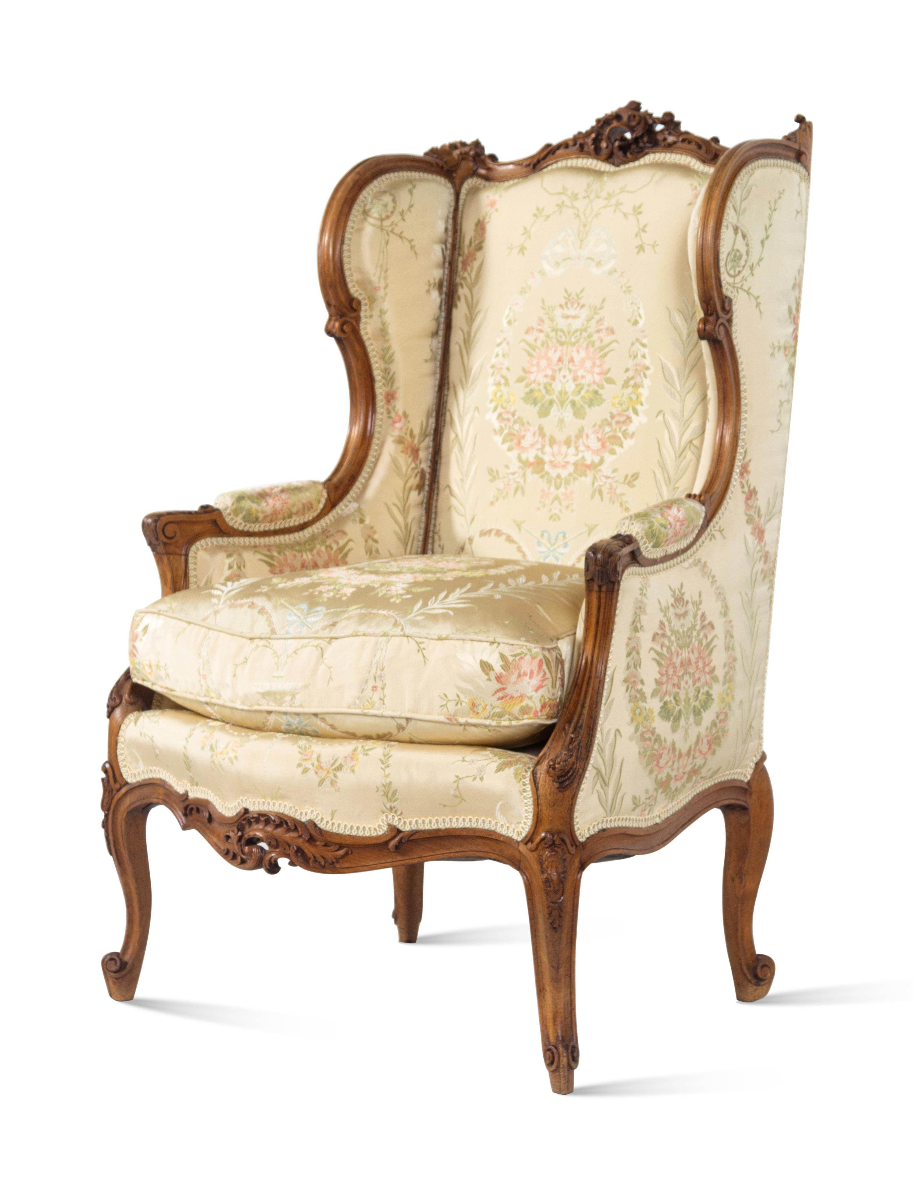 A Louis XV Style Carved Walnut Bergere