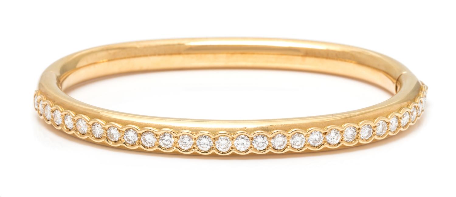 An 18 Karat Yellow Gold and Diamond Bangle Bracelet, Swiss, 23.25 dwts.