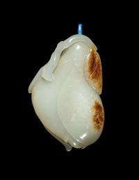 A Chinese Russet and White Jade ‘Magnolia’ Snuff Bottle