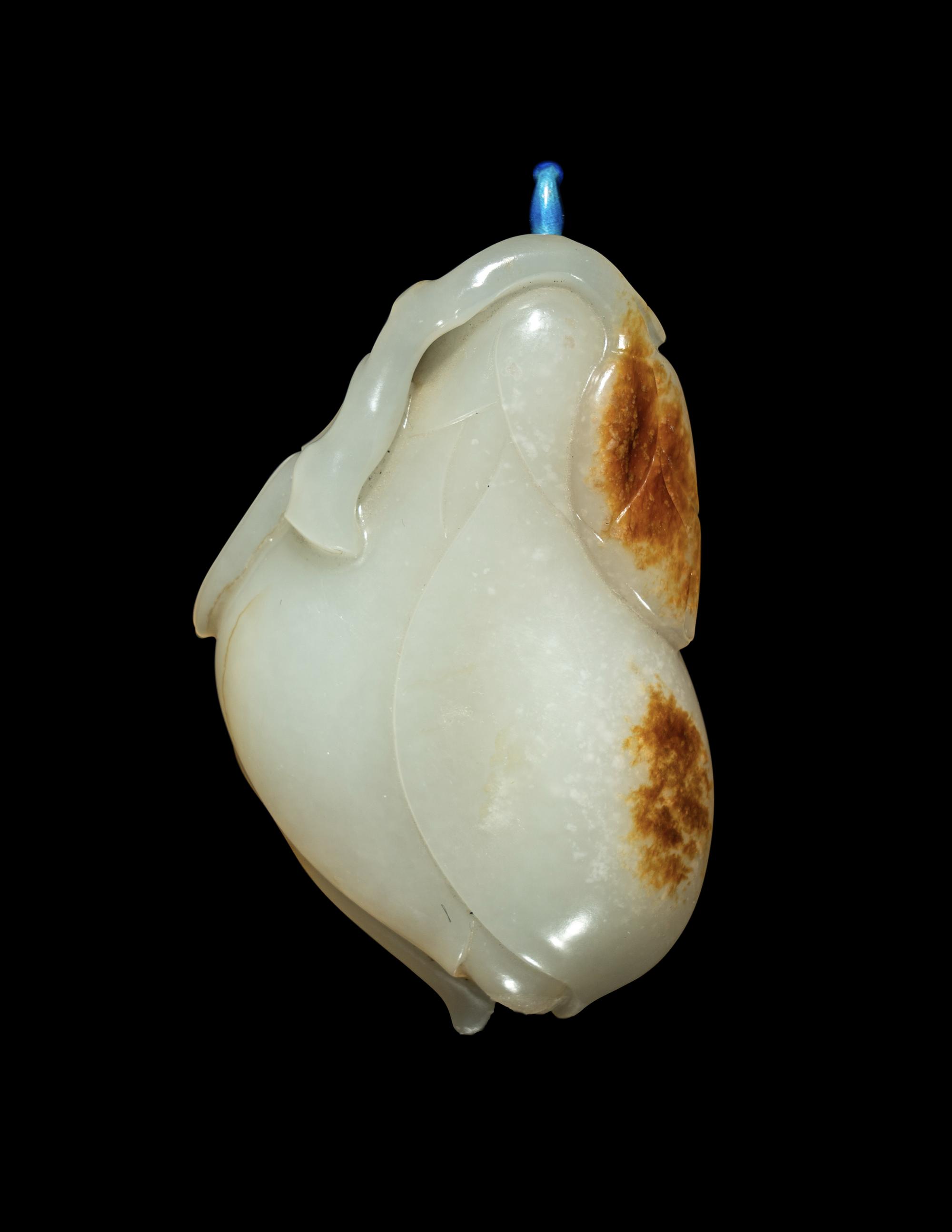 A Chinese Russet and White Jade ‘Magnolia’ Snuff Bottle